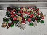 Full assortment of ornaments and ribbon on table
