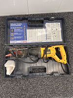 Full view of DeWalt reciprocating saw inside Bosch case with accessories