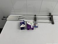 Overall lot showing crutches and three boxed personal care items