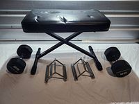 Group view of bench, dumbbells and handles