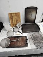overview of all cookware and bakeware items on table