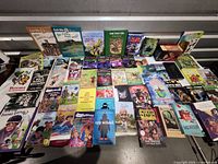 Top-down view of full assortment of books laid out on table