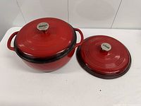 Dutch oven with one lid on, second lid aside