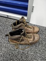 Side view of both Timberland boots showing uppers, laces, and logo