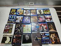 Full overhead of 20 disc cases laid out in 4x5 grid