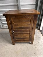 Front view of wooden end table cabinet