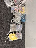 Packaged Shein swimsuits on carpet