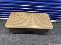 Top view of wicker coffee table showing woven surface and shape
