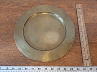 Top view showing full brass plate with rulers indicating diameter