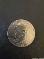 Obverse view of Eisenhower dollar showing portrait, date, mint mark