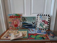 All nine books spread out on table