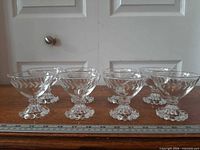 Group of eight coupes showing overall style and ruler for scale