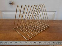 angled view showing gold-tone wire triangular slots