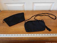 Both clutches side by side with ruler for scale