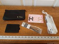 All five accessories laid out with ruler for scale
