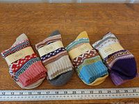 All four pairs arranged side-by-side with ruler for scale