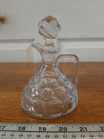 Full view of cruet showing pattern, handle and stopper
