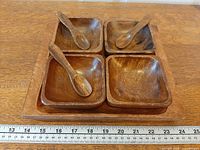 Top view of tray holding four bowls and visible spoons