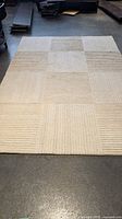 Top view of entire beige bamboo-wool rug