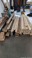 Stack of assorted dimensional lumber on floor