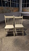 Pair of spindle-back chairs front view