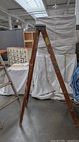 Full view of A-frame wooden ladder