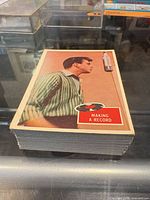 Stack of vertical vintage trading cards, top card captioned "Making A Record"