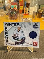 Front of card showing player image, jersey swatch, subset title