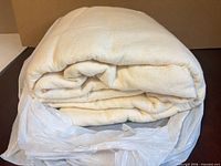 Folded cotton batting inside plastic bag