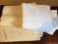 Both fabric pieces folded on table