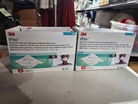 Front view of two 3M VFlex 1804S mask boxes