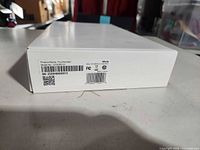 Box side label showing product name Touchscreen, model HS18BASE, color white, serial number, barcodes, compliance logos