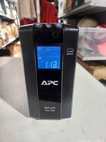 Front view showing APC Back-UPS Pro 700 with powered LCD at 113 V