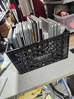 Crate containing 16 assorted Apple laptops