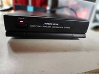 Front view of Archer transmitter showing branding, power LED and Transmitter label