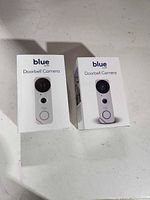 Front view of two retail boxes showing product images and branding