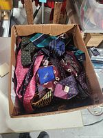 Top view of cardboard box showing variety of ties