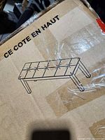 Carton top view with line drawing of bench