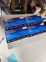Four sealed boxes of Microflex Cobalt gloves