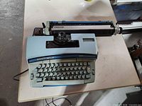 Top view of Smith Corona Coronet Super 12 typewriter with carriage cover removed showing keyboard and mechanism