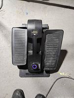 Top view of Cubii Junior elliptical showing foot pedals and resistance dial