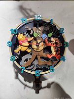 Front of clock showing Pooh, Tigger, numerals, gear motif