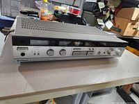 Front view of Hitachi HTA-2 tuner amplifier showing controls and display