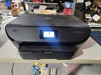 Front view of HP Envy Photo 6255 printer on table
