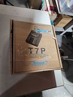 Closed box showing Hypercom T7P branding