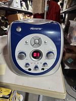 Front view showing control panel, LED display reading "01", and brand name