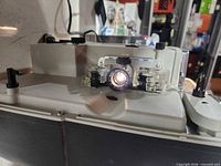 Front view showing lens, film gate and control knobs