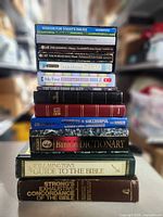 Full stack of 14 books showing spines