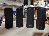 Front view of the four Sony speakers with grilles
