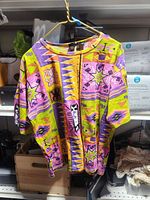 Front view of Hobknob Southwestern print top hanging